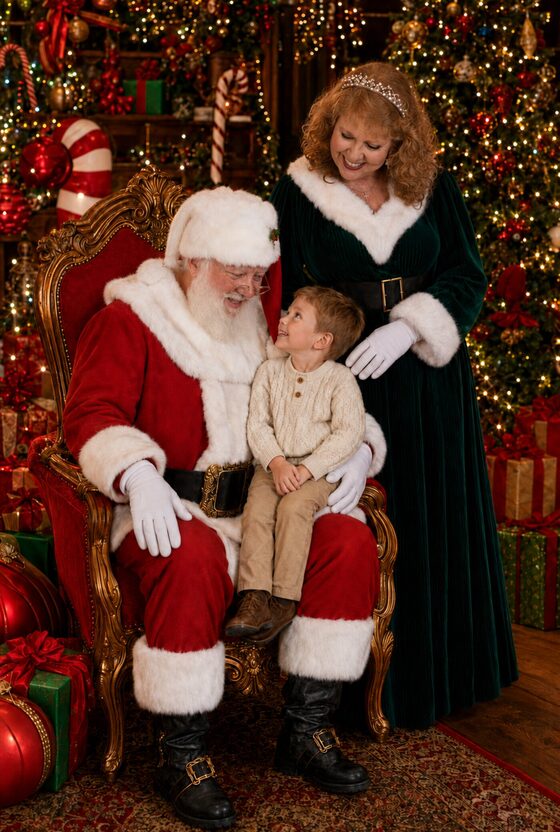 A child visiting with Santa Dave