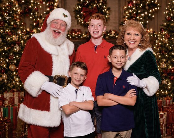 Santa Dave and Mrs. Claus with their grandsons